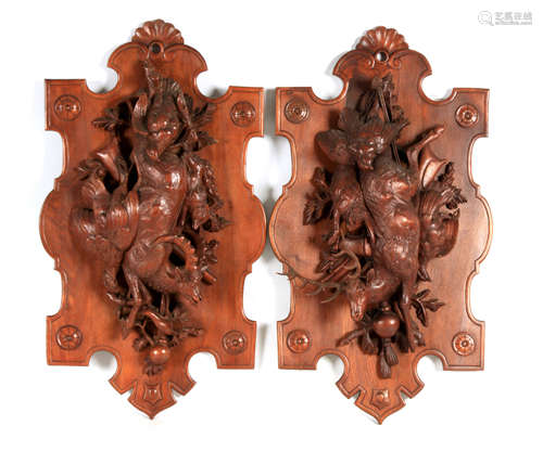 A LARGE PAIR OF LATE 19TH CENTURY CARVED BLACK FOREST WALL P...