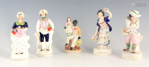 A PAIR OF 19TH CENTURY STANDING STAFFORDSHIRE FIGURES of Spr...