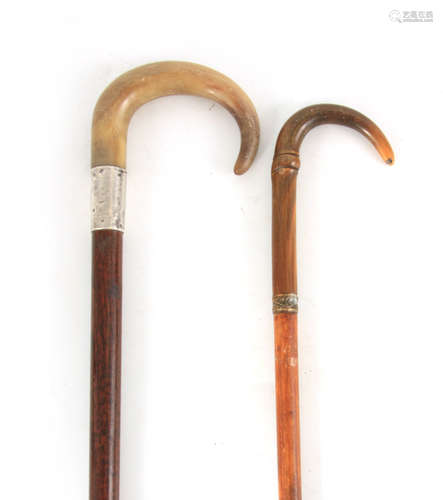 TWO LATE 19TH CENTURY RHINO HORN HANDLED WALKING STICKS one ...