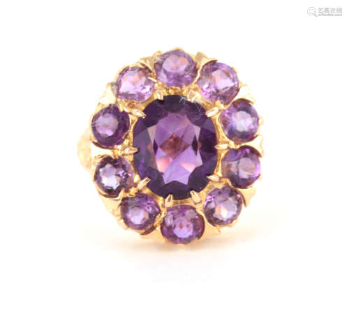 A LADIES 9CT YELLOW GOLD AMETHYST CLUSTER RING the brilliant...