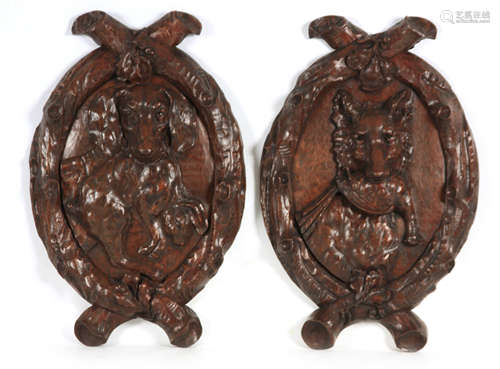 A LARGE PAIR OF 19TH CENTURY CARVED OAK WALL PLAQUES modelle...