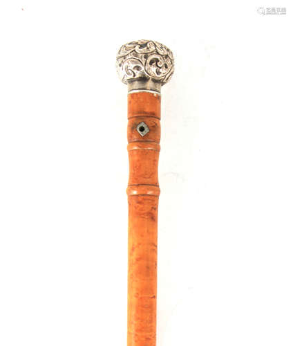 AN EARLY 20TH CENTURY SILVER TOPPED WALKING STICK with birds...