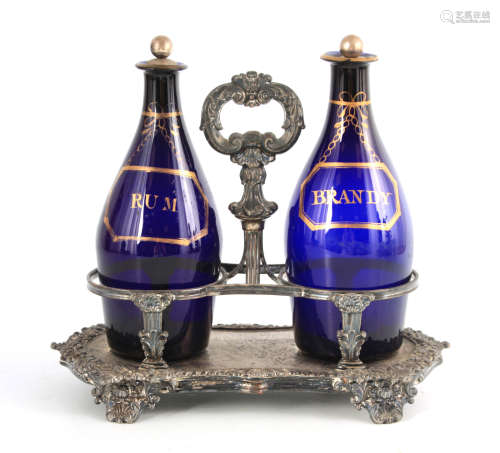 TWO EARLY 19TH CENTURY BRISTOL BLUE DECANTERS FOR RUM AND BR...