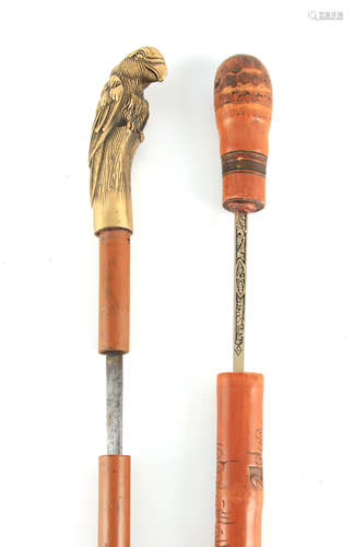 TWO EARLY 20TH CENTURY SWORD STICKS one having a brass bird ...