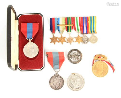 A COLLECTION OF MEDALS to include two service medals, a grou...