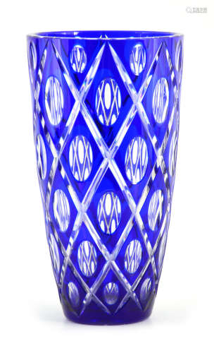 A BOHEMIAN BLUE OVERLAY AND CLEAR TAPERING GLASS VASE with l...