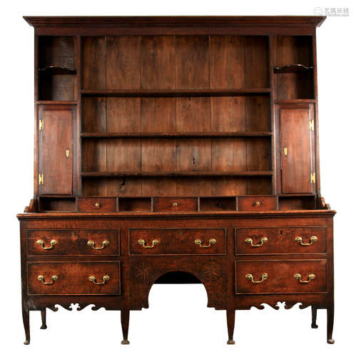 AN 18TH CENTURY SHROPSHIRE OAK DRESSER AND RACK with unusual...