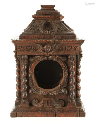 A 17TH CENTURY CARVED OAK JACOBEAN CLOCK CASE/FRAME the elab...