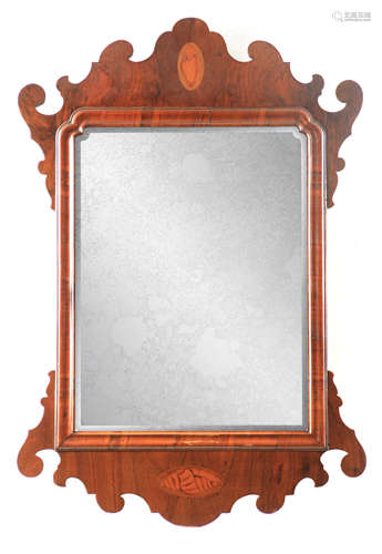 AN EARLY 19TH CENTURY FIGURED WALNUT HANGING MIRROR with cus...