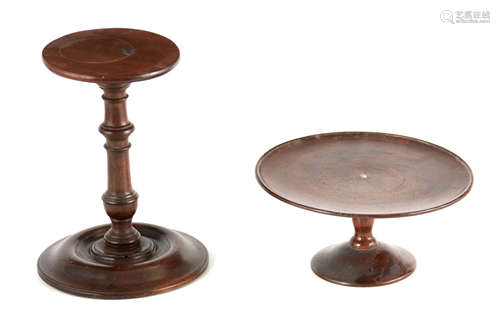 A 19TH CENTURY MAHOGANY CANDLESTAND with turned stem and wid...