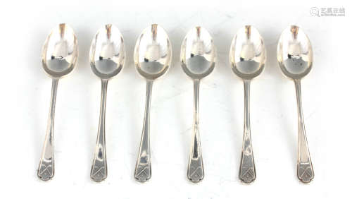 A SET OF SIX GEORGE V GOLFING SILVER TEASPOONS decorated wit...