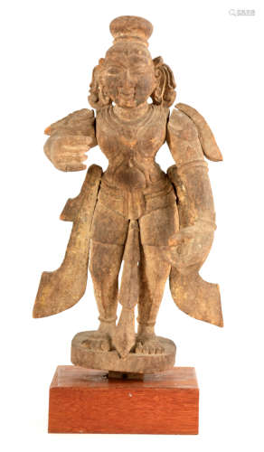 AN EARLY TIBETAN CARVED WOOD FIGURE OF A STANDING BUDDHA mou...