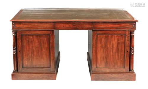 A LATE GOERGE III MAHOGANY PARTNERS DESK having a green leat...