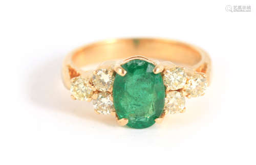 A LADIES 18CT YELLOW GOLD EMERALD AND DIAMOND RING with bril...