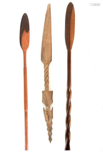 THREE 19TH CENTURY AFRICAN HARDWOOD SPEARS one with mask hea...