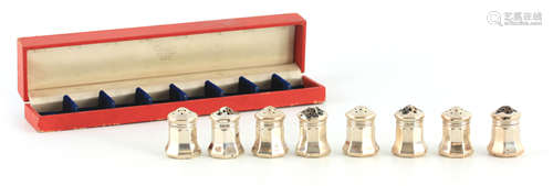 A SET OF EIGHT CASED CARTIER STERLING SILVER SALTS of bulbou...