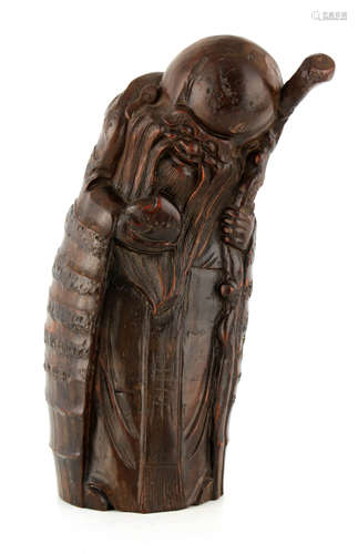 A CARVED BAMBOO FIGURE OF SHOU LAO IMMORTAL GOD OF LONGEVITY...