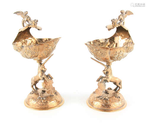 A PAIR OF GEORGE V SILVER GILT TABLE SALTS with shell-shaped...