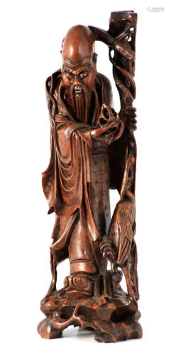 A LATE 19TH CENTURY CHINESE CARVED HARDWOOD STATUE depicting...