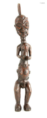 A 19TH CENTURY AFRICAN TRIBLE CARVED WOOD FIGURE OF A MALE 6...