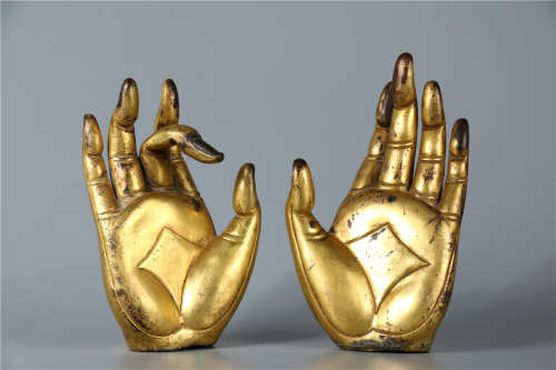 A PAIR OF GILT BRONZE BUDDHA'S HANDS, MING DYN.