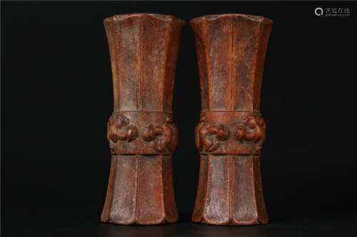 A PAIR OF HUANGHUALI WOOD FLOWER RECEPTACLES