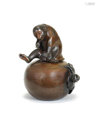 A large bronze vessel and cover in the form of a monkey perc...