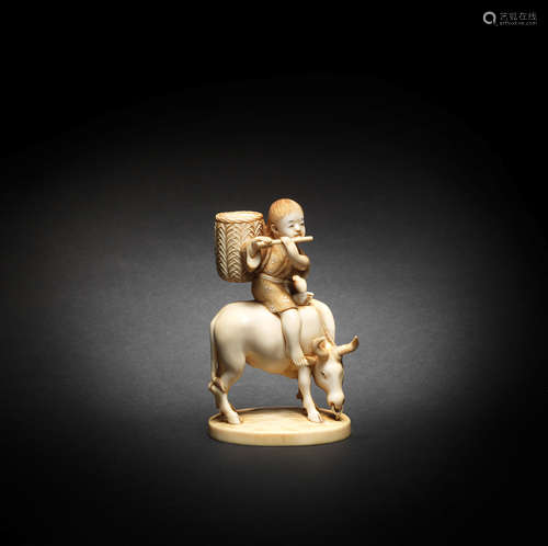 An ivory okimono of a boy on an ox By Hozan, Meiji era (1868...