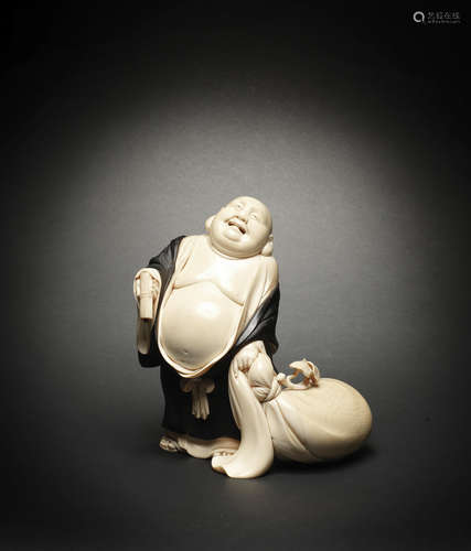 A wood and ivory okimono of Hotei By Shoko/Katsumitsu, Meiji...