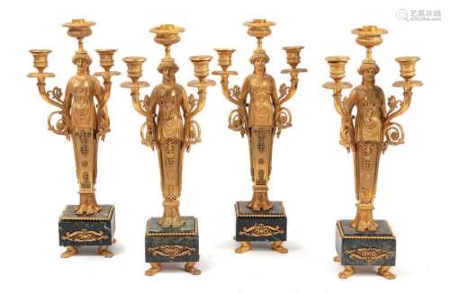 四件套烛台鎏金青铜，仿古风格的年轻女子造型，鞘状握柄，支撑三盏灯...