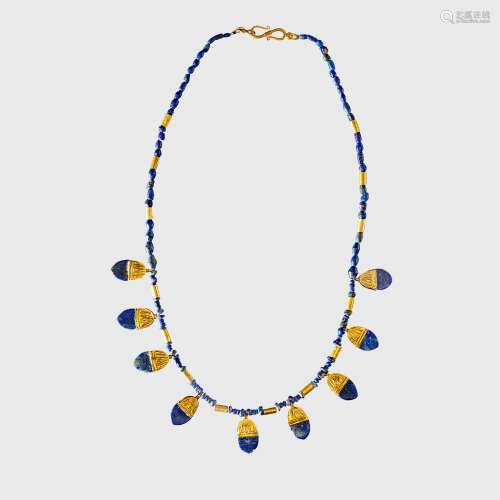 WESTERN ASIATIC LAPIS NECKLACE WITH GOLD PENDANTS NEAR EAST,...