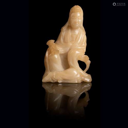 PALE YELLOW SOAPSTONE CARVING OF A SEATED GUANYIN QING DYNAS...