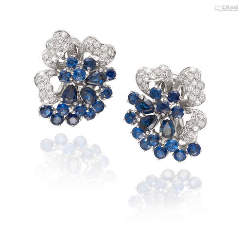 PAIR OF 18K WHITE GOLD, SAPPHIRE AND DIAMOND CLUSTER EARCLIP...