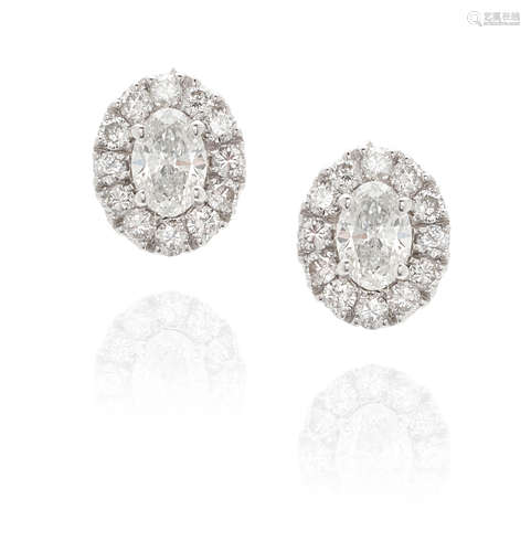 PAIR OF 18K WHITE GOLD AND DIAMOND HALO EARRINGS