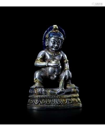 A Silver Figure of Jambhala