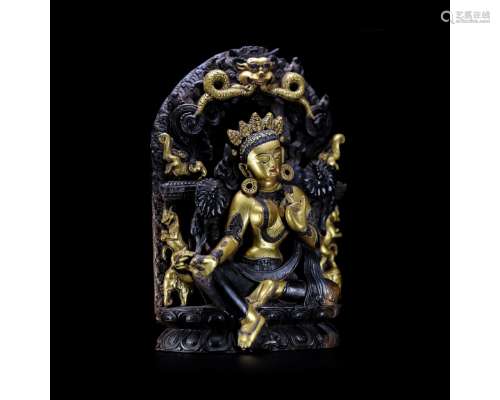 A Gilt Zitan Figure of Green Tara