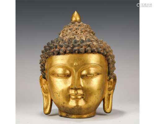 A Chinese Gilt-Bronze Buddha Head