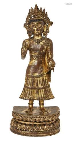 A large Sino-Tibetan gilt bronze standing figure of Avalokit...