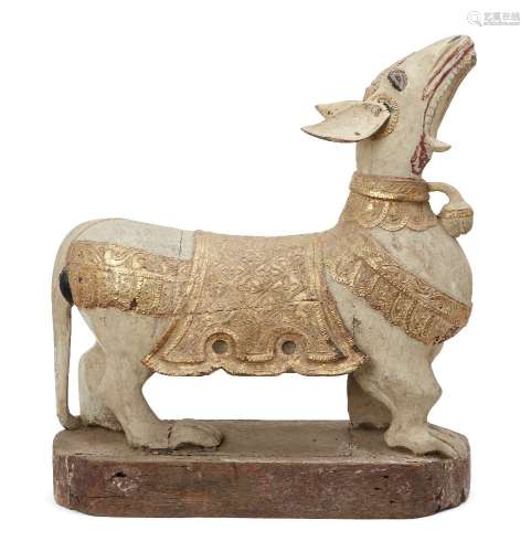 A spectacular Burmese carved gilt wood dog, 19th century, wi...