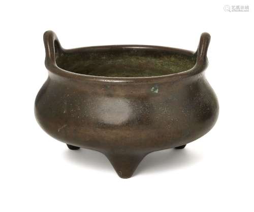 A Chinese bronze two-handled tripod censer, 18th/19th centur...