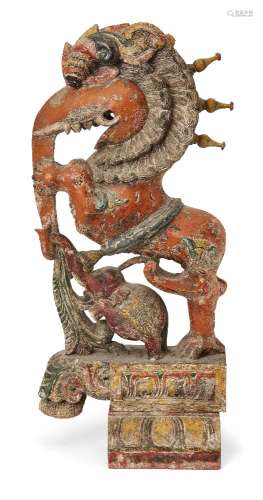 A large Balinese carved polychrome wood figure, early 20th c...