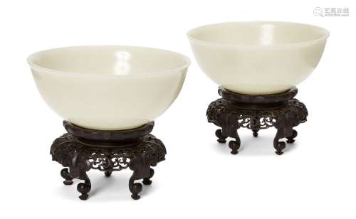 A pair of Chinese pale celadon jade bowls, 19th century, eac...