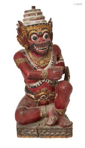 A Balinese polychrome wood carving of a temple guardian, ear...