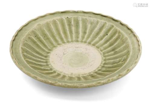 A Vietnamese stoneware green-glazed dish, 14th century, with...