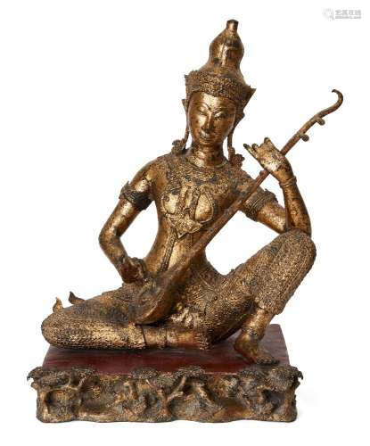 A Thai gilt bronze figure of a prince musician, early 20th c...