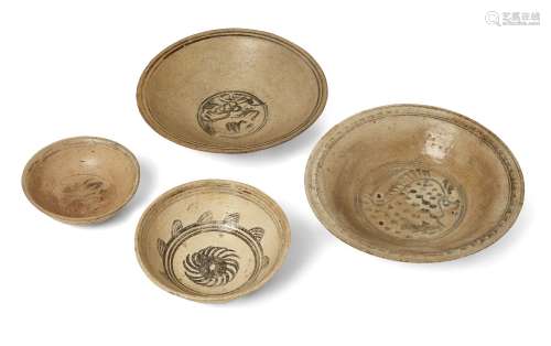Four Thai Sawankhalok pottery bowls, 16th century, decorated...