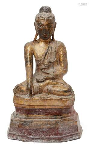 A Burmese lacquered and gilded papier mâché seated Buddha, M...