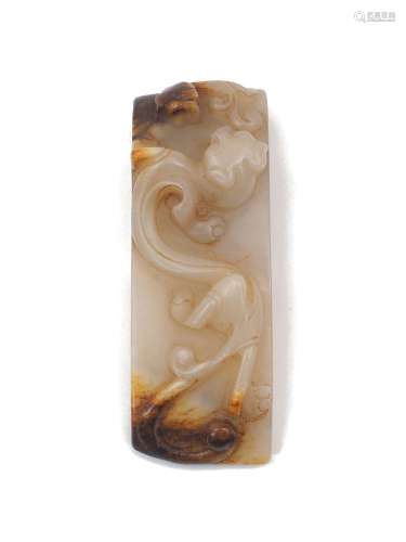 A Chinese green jade buckle, 20th century, carved with a chi...