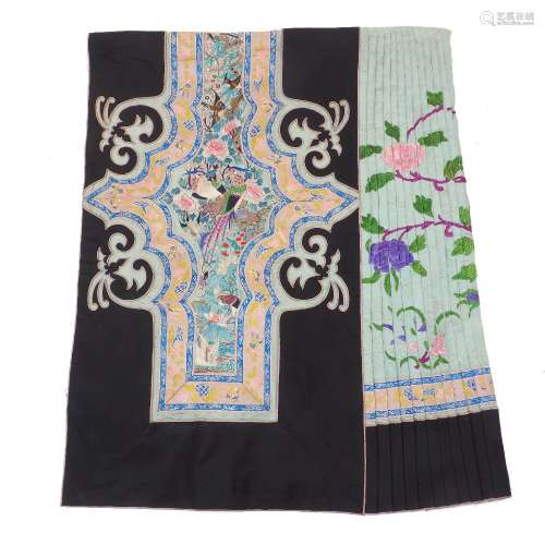 A Chinese silk embroidered skirt of two panels, each with pl...