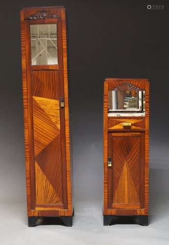 An Art Deco narrow cabinet with stepped top above mirrored d...